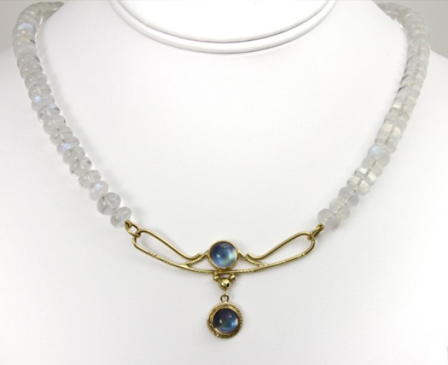 Boston area jeweler Daniel Spirer handcrafted this necklace of blue sheen moonstone beads with 18k and 22k yellow gold clasp