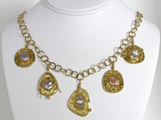 18k and 22k yellow gold necklace with Chinese freshwater keshi pearls and orange sapphires, available at Spirer Jewelers, Boston