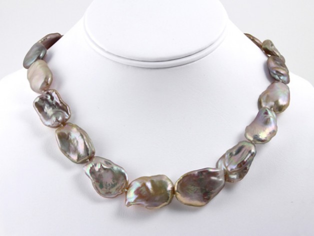 Daniel Spirer Jewelers of Boston presents this strand of large Chinese freshwater keshi pearls with 18k yellow gold clasp