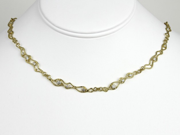Daniel R. Spirer Jewelers of Cambridge, Massachusetts presents this 18k yellow gold necklace with diamonds